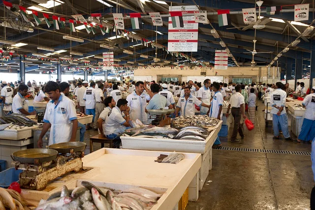Fish traders and shoppers inside Dubai Fish Market.