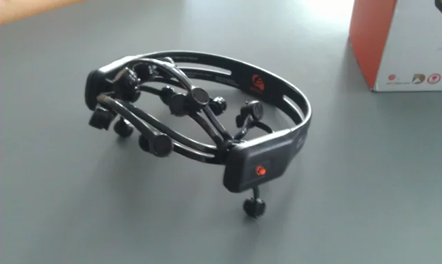 Representative EEG headset with multiple sensors, resting on a table