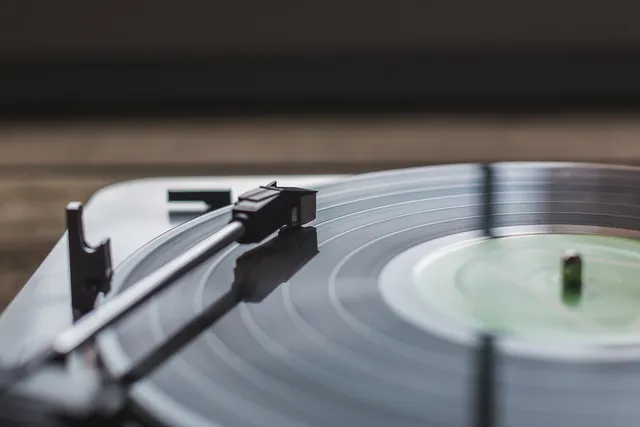 A turntable playing a vinyl record.