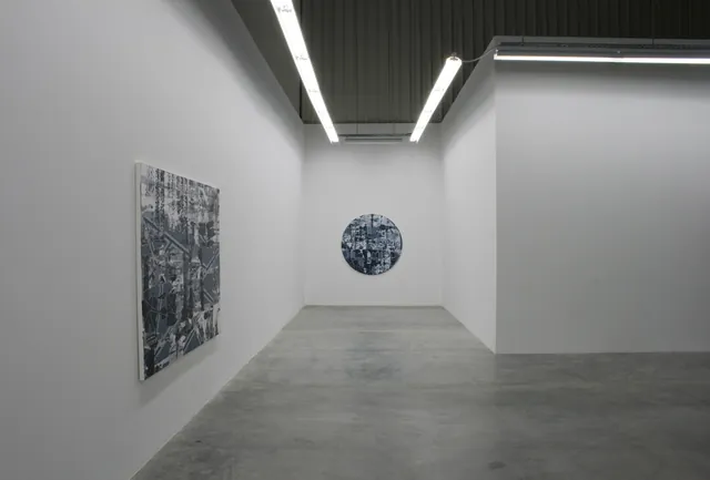 Contemporary art on display inside a minimalist gallery.